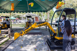 Children Playing on Mini Diggers