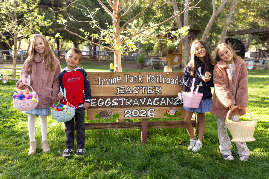 Two children taking photos with the Easter Bunny at the 2026 Easter Eggstravaganza at Irvine Park Railroad Four children pose at Irvine Park Railroad's Easter Egg Hunt at the 2026 Easter Eggstravaganza